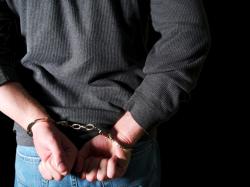 Man from Lawrence MA in handcuffs